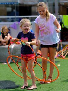 Young girl and teen enjoying their school holiday activity with roundabout circus on the central coast of nsw