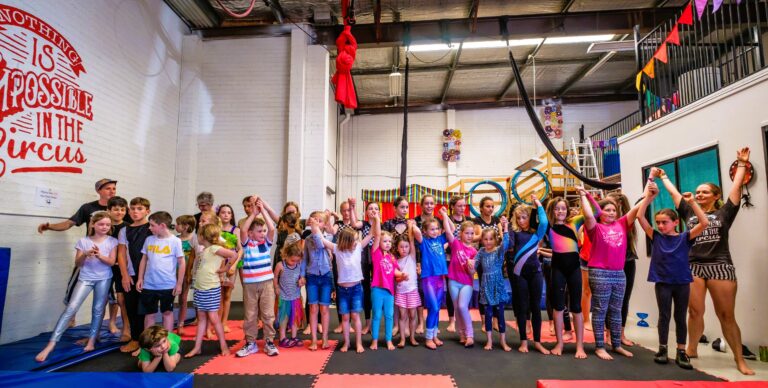 Image of circus performers taking a bow having enjoyed a fulfilling school holiday activity with roundabout circus and experiencing the joy that circus can bring on the central coast of nsw.