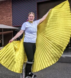 During our school holiday workshops, you can learn to still walk, like this teen is doing, and also learn how Isis wings can be added to costumes and props to enhance the overall effect.