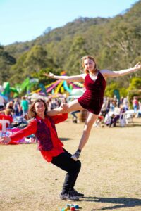 Members of our Youth Performance Troupe showcasing a challenging acrobatic skill, under the bright blue sky of the Central Coast at The Horses Birthday Glenworth Valley.